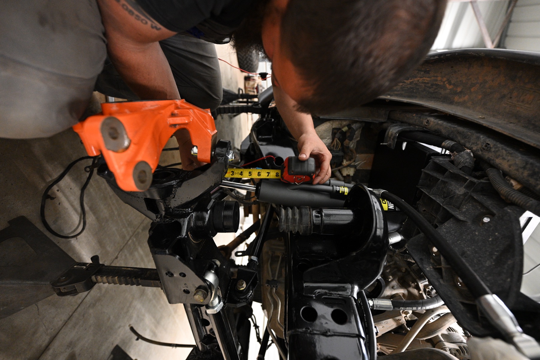 Precise measurement during a Bilstein suspension install at ABO