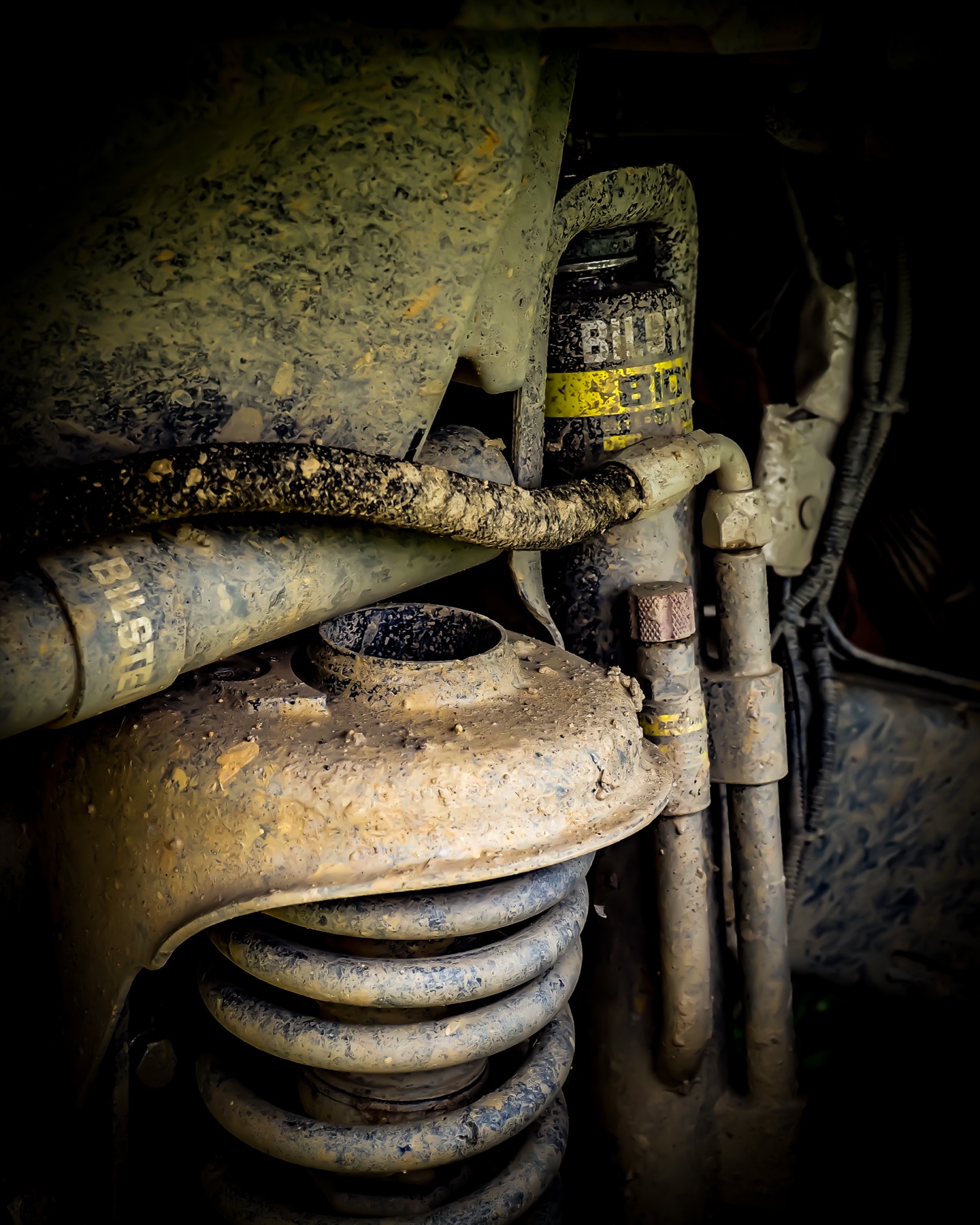 Suspension components caked in mud after the Terra Trophy race